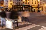 Pedestrians crossing street at dusk in Georgetown, Washington, DC